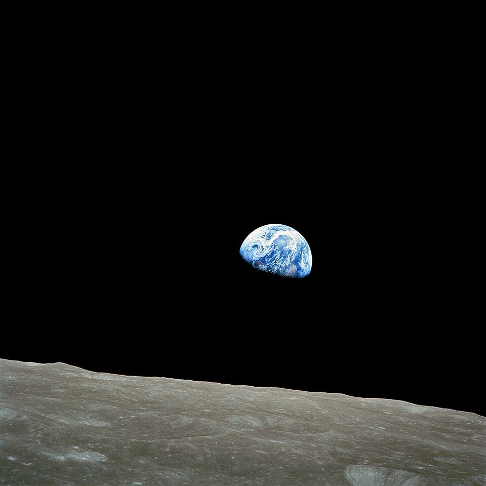 Earth rising above the lunar horizon, photographed from Apollo 8