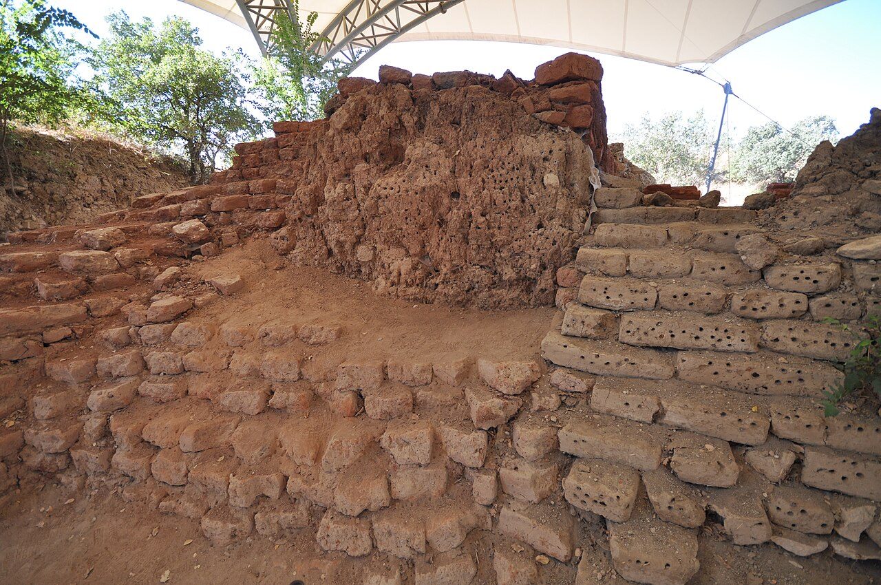 The excavated ruins and trench walls of ancient Troy at Hisarlik.