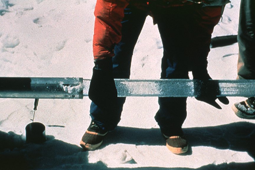 A cylindrical ice core sample fresh from the drill