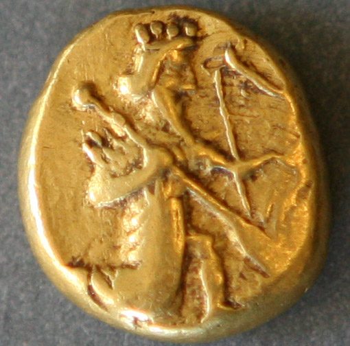 A gold coin stamped with a kneeling royal archer.